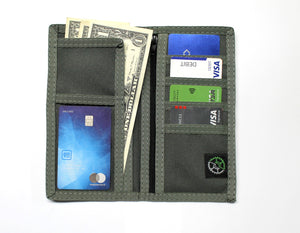 Executive nylon checkbook wallet in the color granite shown open with contents.